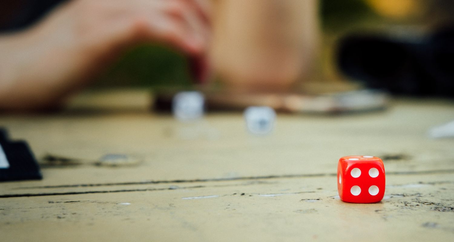 a red dice on a board game